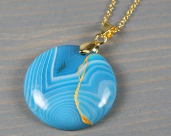 Kintsugi repaired blue banded agate pendant on a cable chain necklace