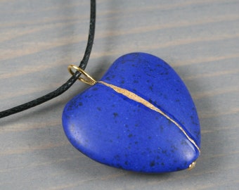 Blue howlite broken heart pendant with kintsugi repair on black cotton cord
