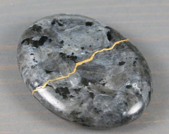 Kintsugi repaired larvikite worry stone