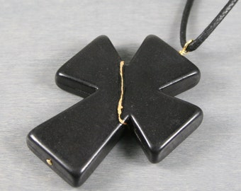 Large kintsugi repaired black howlite cross pendant on a thick, adjustable length black cotton cord necklace