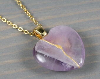 Broken heart pendant in amethyst with kintsugi repair on a cable chain necklace