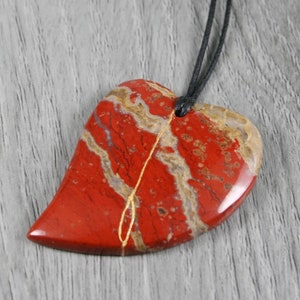 Kintsugi repaired brecciated jasper broken heart pendant on and adjustable length black cotton cord