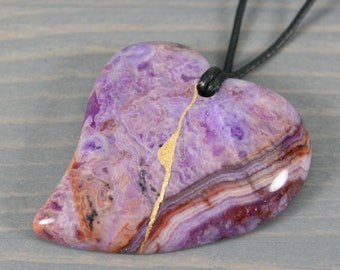 Kintsugi repaired purple crazy lace agate broken heart pendant on black cotton cord