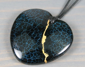 Kintsugi repaired black dragon veins agate broken heart pendant on an black cotton cord necklace