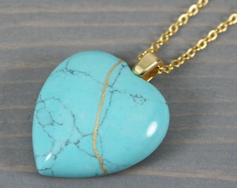 Broken heart pendant in imitation turquoise with kintsugi repair on chain necklace