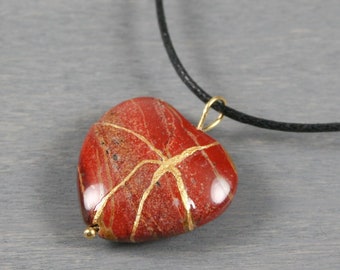 Broken heart pendant in brecciated jasper with kintsugi repair on cotton cord