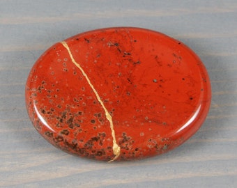 Kintsugi repaired red jasper worry stone