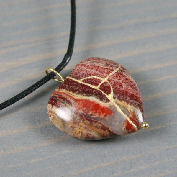 Broken heart pendant in brecciated jasper with kintsugi repair on cotton cord