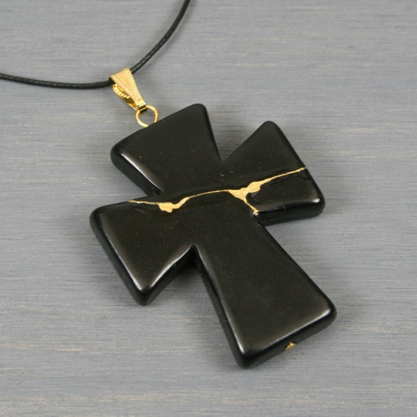 Kintsugi repaired black howlite cross pendant on black cotton cord