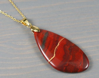Kintsugi repaired rainbow jasper freeform pendant on a cable chain necklace
