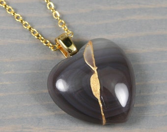Broken heart pendant in botswana agate with kintsugi repair on cable chain necklace