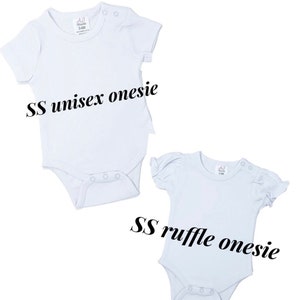 May include: Two white baby onesies, one with short sleeves and the other with short ruffle sleeves. The onesies are labeled "SS unisex onesie" and "SS ruffle onesie".