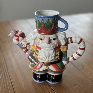 Vintage Nut Cracker Christmas Pitcher / Teapot.