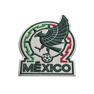 May include: Embroidered patch featuring the Mexican coat of arms. The design includes a green eagle with a soccer ball, surrounded by a circular border with green and red accents. The word "MEXICO" is embroidered in green.