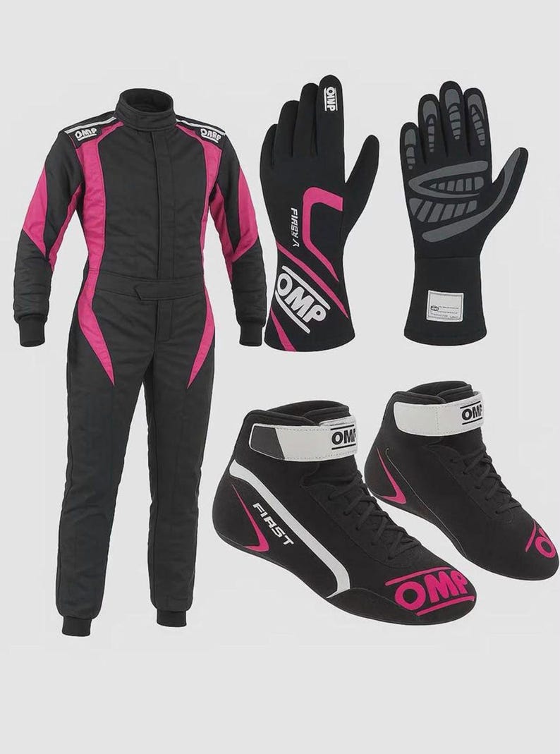 May include: A black and pink racing suit with OMP branding, a pair of black and pink racing gloves with OMP and FIRST logos, and a pair of black and pink racing boots with white ankle straps and OMP branding on the sides and heels.