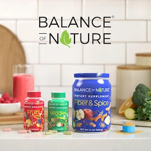 May include: Image of Balance of Nature dietary supplements. The image features three bottles and a glass of smoothie. The bottles are labeled "Fruits", "Veggies", and "Fiber & Spice". The "Fiber & Spice" bottle is 14 oz (400 g).