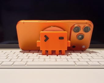 Magnetyczny stojak na telefon Claude Code Pixel, drukowany w 3D dodatek technologiczny dla programistów