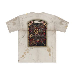 May include: A short-sleeved t-shirt with a distressed, off-white background featuring a large graphic on the back. The graphic includes the text "G.O.T. ORIGINAL" in a gothic font, with "Est. 1995" above it. The design incorporates red, black, and gold elements.
