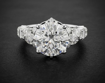 rund diamantförlovningsring markis baguette oval kluster halo vitguldsvigselring