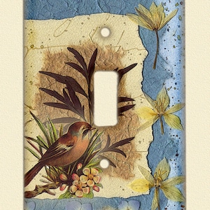 May include: A light switch cover with a vintage floral design featuring a brown bird perched on a branch with yellow flowers. The background is a blue and brown textured design with a white border.