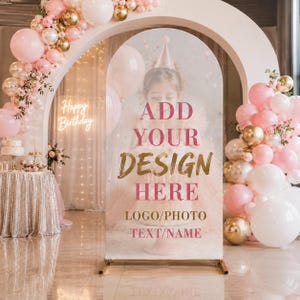 May include: An arched display stand featuring a semi-transparent surface with the text ADD YOUR DESIGN HERE, LOGO/PHOTO, and TEXT/NAME in pink and gold. The stand is framed by a large balloon arch in shades of pink, white, and metallic gold.