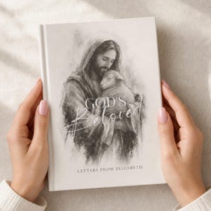 May include: A hardcover book with a cream-colored cover featuring a charcoal-style sketch of a figure holding a lamb. The text "GOD'S Beloved" is printed in a script font above the words "LETTERS FROM ELIZABETH" in a simple sans-serif font.