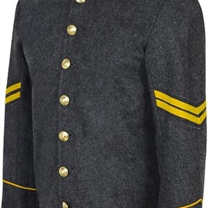 May include: A charcoal gray wool-textured jacket featuring a high mandarin collar with yellow piping. The front closure has seven gold-toned metal buttons. Each sleeve displays two horizontal yellow stripes and yellow piping at the cuffs.