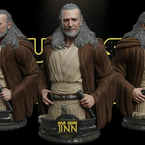 May include: A detailed bust of Qui-Gon Jinn featuring long gray hair, a beard, and a brown robe over a beige tunic. The figure wears a utility belt with a lightsaber hilt and stands on a black base with the yellow text "QUI GON JINN" displayed.
