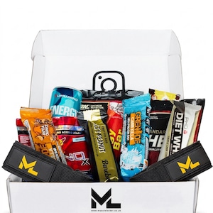May include: A white cardboard box containing various fitness supplements, including protein bars, an energy drink, and two black wrist wraps with a yellow ML logo. The box features an Instagram icon and the Muscle Locker logo with the text musclelocker.co.uk.