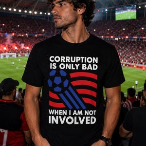 May include: A black short-sleeve t-shirt featuring white text that reads CORRUPTION IS ONLY BAD WHEN I AM NOT INVOLVED. The design includes a blue football graphic with blue motion lines and red horizontal wavy stripes on the front.