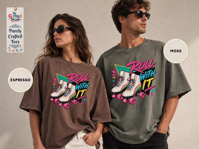 A woman wearing a brown t-shirt with a graphic of roller skates and the text "Roll with it" and a man wearing a gray t-shirt with the text "MOSS" and a graphic of roller skates.