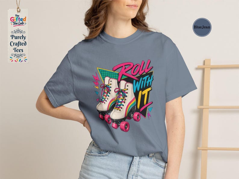 a t-shirt with a graphic design of roller skates, along with various other items such as a hat, a notebook, and a small bowl.