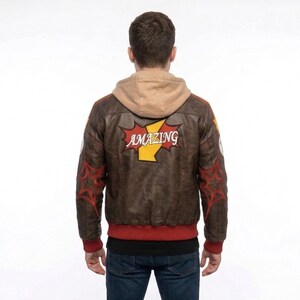 Rear view of a man on a city rooftop wearing Marvel Rivals Inspired Spider-Man Bomber Leather Jacket with Hoodie with red web designs on the sleeves and a large red and yellow patch reading "AMAZING" on the back.