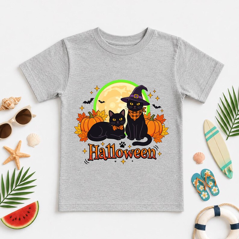 A graphic design featuring two black cats, one wearing a purple witch hat and orange bandana, sitting among pumpkins and autumn leaves under a full moon with the word Halloween below.