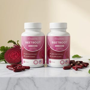 May include: Two white Rosabella Beetroot dietary supplement bottles with pink labels and capsules. The labels read "BEETROOT" and "30 DAY SUPPLY 1300MG PER SERVING". A sliced beet and loose capsules are also visible.