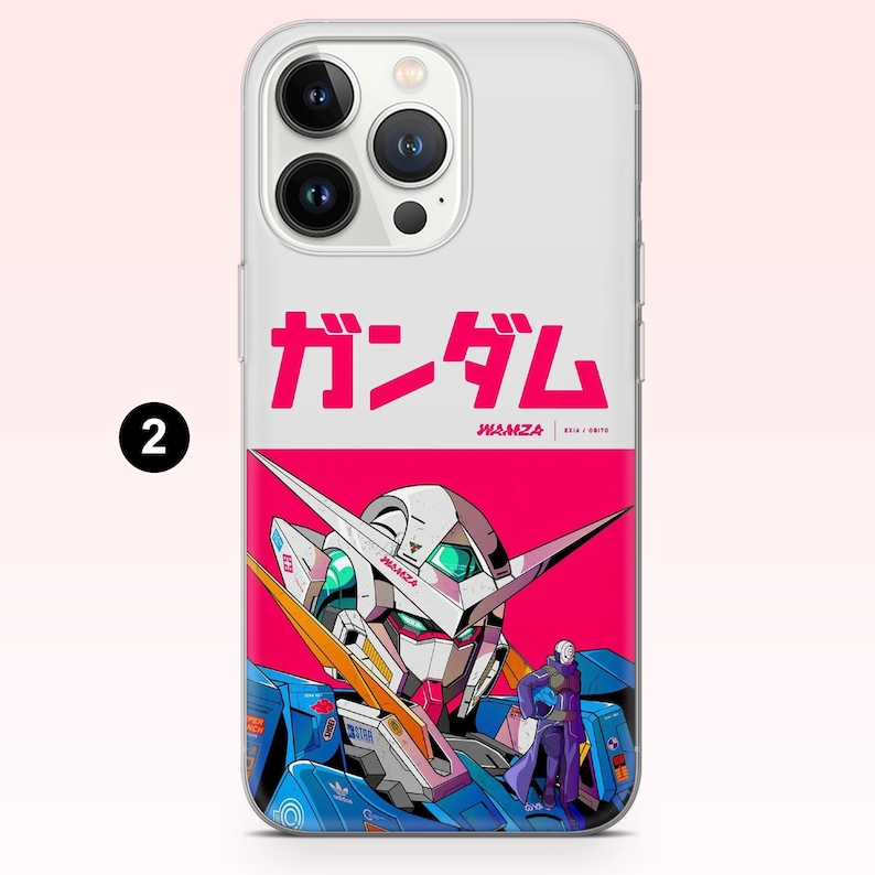 May include: A clear smartphone case featuring a graphic design with the Japanese text ガンダム, the word WAMZA, and an illustration of a white and blue robot head against a vibrant pink background, with a small figure standing in the foreground.