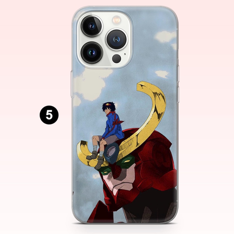 May include: A clear smartphone case featuring a graphic of a person with dark hair wearing a blue jacket and shorts, sitting atop a large red robotic head with a prominent gold curved horn against a light blue sky with white clouds.