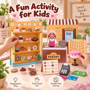 May include: A cardboard bakery playset featuring a display shelf with various pastry cutouts, a counter with a character illustration, a menu board with prices, a toy cash register, play money, and a cake on a stand with pink frosting.