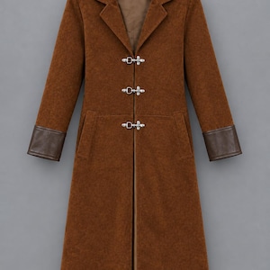 May include: A long, brown coat featuring a notched collar, long sleeves with dark brown cuffs, and three silver-toned metal toggle closures down the front. The coat has a structured silhouette with two vertical side pockets and a smooth interior lining.