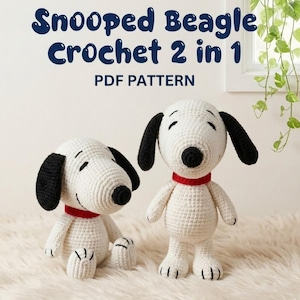 May include: Two Snoopy crochet dolls, one seated and one standing, are displayed. Both are white with black ears and noses, and wear red collars. The text "Snooped Beagle Crochet 2 in 1 PDF PATTERN" is at the top.
