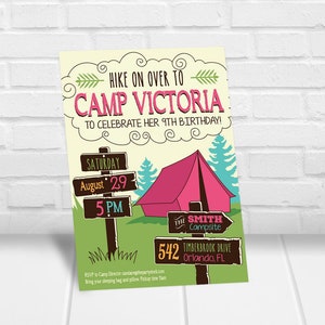 May include: A colorful invitation to a 9th birthday party at Camp Victoria. The invitation features a cartoon illustration of a campsite with a tent, trees, and a wooden signpost with the text "Saturday, August 29, 5 PM". The text "HIKE ON OVER TO CAMP VICTORIA TO CELEBRATE HER 9TH BIRTHDAY!" is written in a pink cloud shape. The text "THE SMITH CAMPSITE 542 TIMBERBROOK DRIVE ORLANDO, FL" is written on a brown sign with an arrow pointing to the right. The text "RSVP to Camp Director candacegthepartystark.com Bring your sleeping bag and pillow Pickup time 1am" is written at the bottom of the invitation.