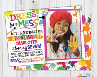 May include: A colorful invitation for a child's birthday party. The invitation features a photo of a young girl with paint on her face and hands. The text on the invitation reads "Dress for a Mess, We're going to put the art in party! Charlotte is turning seven!"  The invitation also includes the date, time, and location of the party.