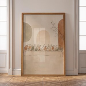 Könnte beinhalten: Ein gerahmter Kunstdruck mit einer minimalistischen Strichzeichnung des Abendmahls. Das Kunstwerk enthält weiche Aquarellformen in gedeckten Tönen von Salbeigrün, Terrakotta und Beige, mit abstrakten Bogenmotiven und einem zarten botanischen Zweig.