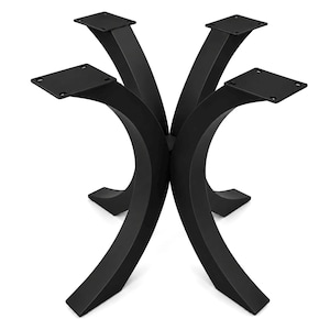 May include: A set of four matte black metal table legs with a curved, arching design. Each leg features a flat, square mounting plate at the top with four pre-drilled holes for attachment, converging at a central point to form a stable base.