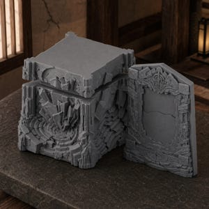 May include: A gray, unpainted resin box with a lid and a separate rectangular panel. The box features intricate, jagged, stone-like textures and geometric carvings on all sides, with a central circular pattern on the front and a matching frame design.