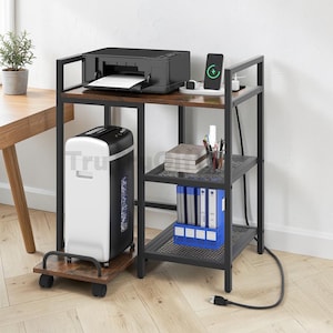 May include: A black metal printer stand with three wooden shelves and a rolling base. The top shelf holds a black printer and a wireless charger. The middle shelf contains a stack of books and a pen holder. The bottom shelf holds a blue file organizer.
