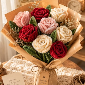 May include: A bouquet of handmade roses in shades of red, pink, and cream, wrapped in brown paper. The bouquet includes green leaves and dried sprigs, tied with twine and a tag that reads "Especially for you."