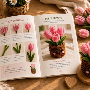 May include: An open instructional book titled Tulip Tutorial and Tulip Flower, featuring step-by-step diagrams for crafting pink pipe cleaner tulips. Beside the book sits a brown crocheted pot containing pink pipe cleaner tulips with a face.