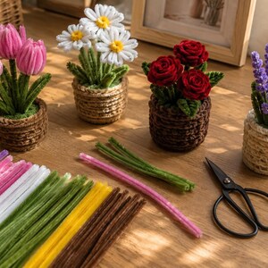 May include: Four potted flower arrangements made from pipe cleaners, including pink tulips, white daisies, red roses, and purple lavender. Beside them are loose colorful pipe cleaners in purple, white, pink, green, yellow, and brown, and black scissors.