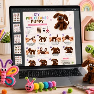 May include: A laptop screen displaying a DIY pipe cleaner puppy craft tutorial PDF, surrounded by colourful pipe cleaner crafts including a butterfly, a caterpillar, and a brown puppy figure, alongside craft supplies like scissors and googly eyes.